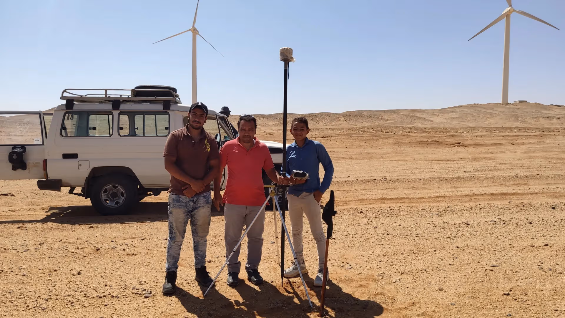 GeoGiza crew surveying a site with GNSS equipment